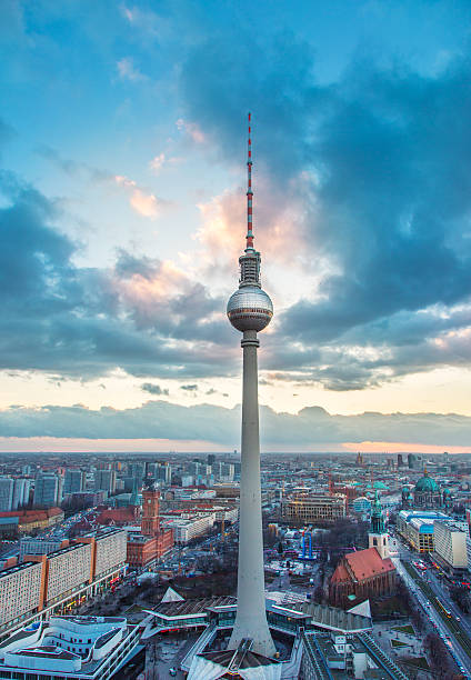 TV Tower - Berlin tv tower Fernsehturm - Berlin tv tower at sunset. Cloudy background. Image taken from the "Park Inn" panorama view point. Camera - Canon 5D mkIII. berlin germany urban road panoramic germany stock pictures, royalty-free photos & images