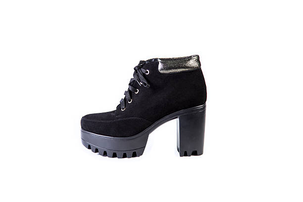 istock Suede women's boots on a white background, black shoes 531460744