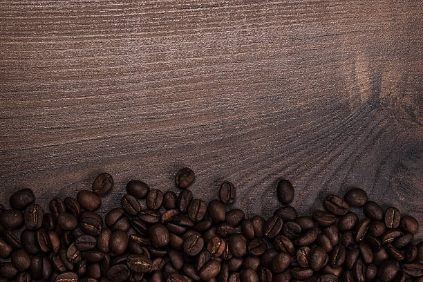 istock coffee beans on the brown wooden background 531461039