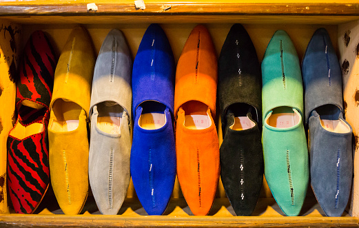 Moroccan slippers / shoes lined up in a street market - Marrakesh souk, Morocco