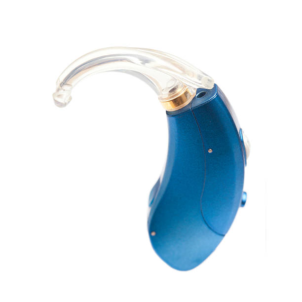 Digital Hearing Aid Blue Hearing Aid isolated on white. hearing aid photos stock pictures, royalty-free photos & images