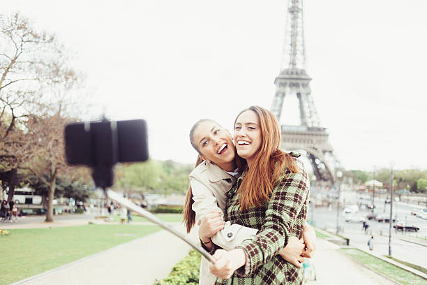 istock Cheerful young women making selfie in front of Eiffel tower 531462546