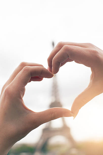 istock Young woman making heart shape with hands 531462712