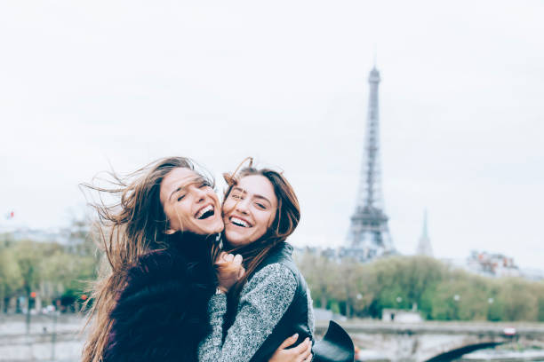 istock Young friends having fun in front of Eiffel tower 531463036