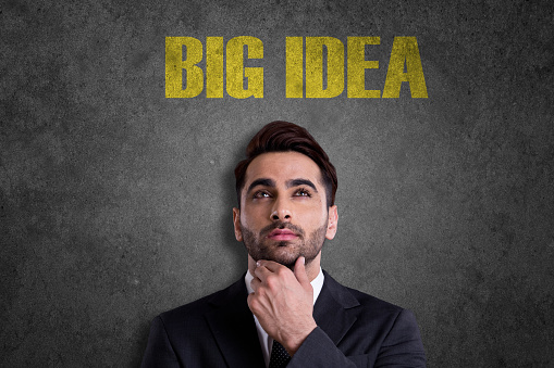 Young businessman with thinking about Big Idea.