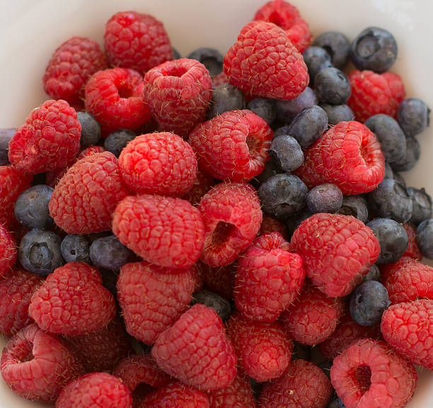 istock Splendid Arrrangement of Raspberries and Blueberries 531465677