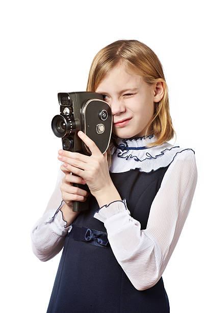 menina operador de filmar com a câmera retro - photographer enjoyment elegance old fashioned imagens e fotografias de stock