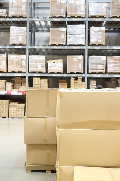 istock interior of warehouse. Rows of shelves with boxes 531468364