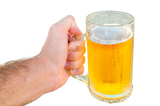 istock Young man hand holding a refreshing beer isolated 531468652