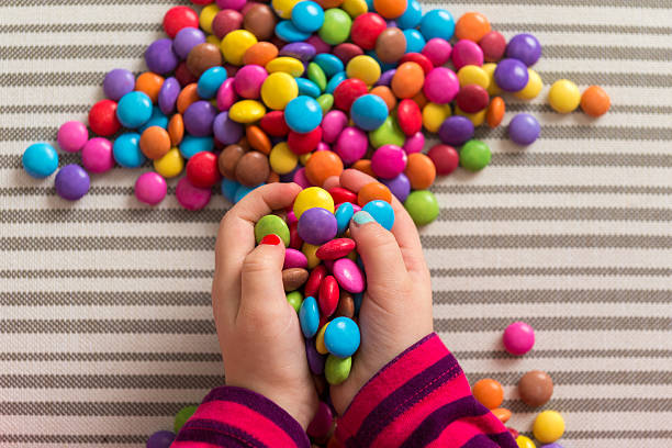 istock Anonymous preschool girl playing with colorful sweets 531469180