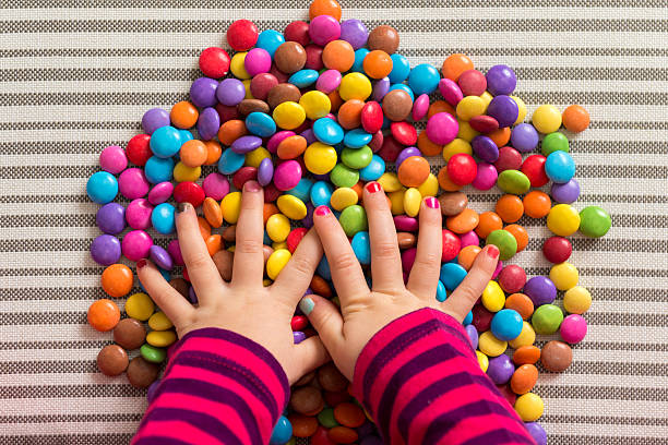 istock Anonymous preschool girl playing with colorful sweets 531469308