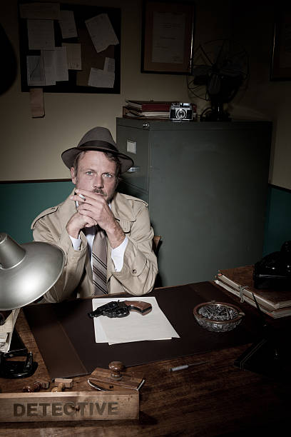 istock Detective smoking at desk 531471722