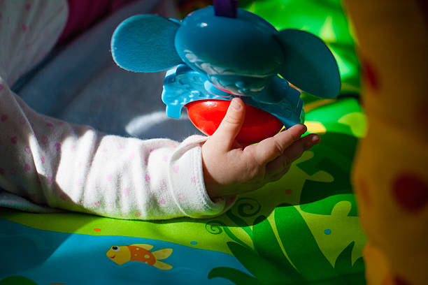 istock Baby Hand Playing with colorful toys 531472926