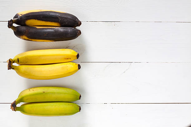 istock Green, yellow and black bananas. 531473432