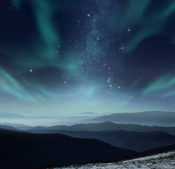 Polar night Starry night sky with aurora polaris over the mountains tranquil evening stock pictures, royalty-free photos & images