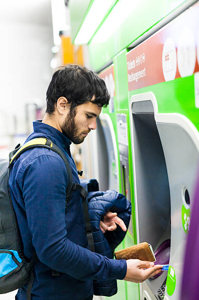istock Young Man Taking Out Cash From ATM in Subway 531475124