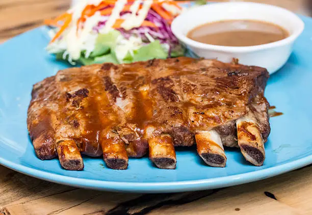 Photo of Barbecue Spare Ribs on blue dish