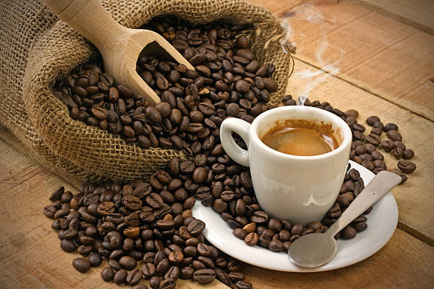 istock coffee cup and grains on wooden table 531476723