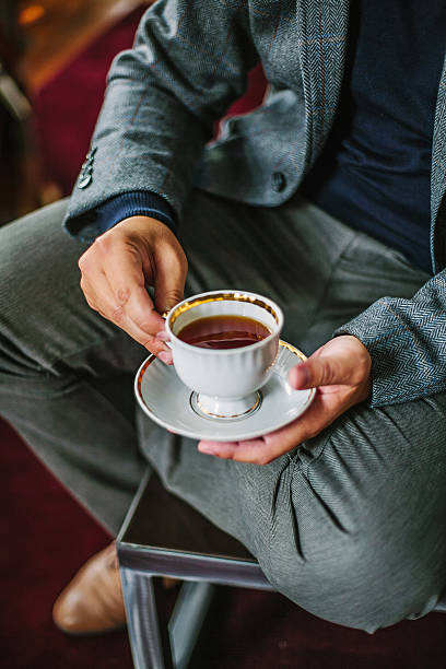 istock Man in tweed suit with a cup of tea. 531476834