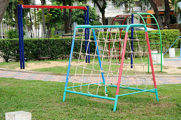 istock Climbing net and chain swing at playground. 531477789