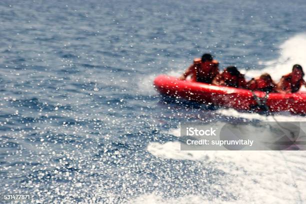 Group Of Four On Tubes On Red Sea Coast Stock Photo - Download Image Now - Inflatable Swim Ring, Nautical Vessel, Tubing