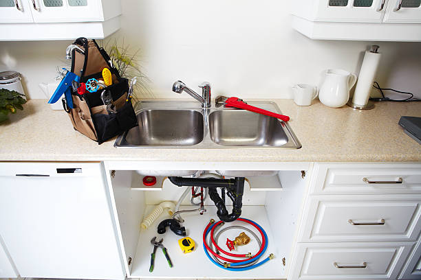 Plumbing tools on the kitchen. stock photo
