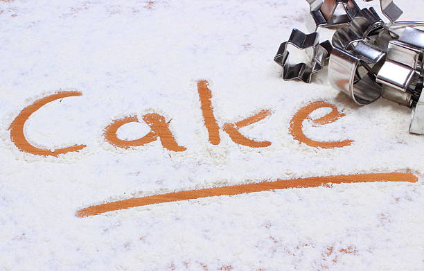 istock Word cake written in flour and cookie cutters 531478191