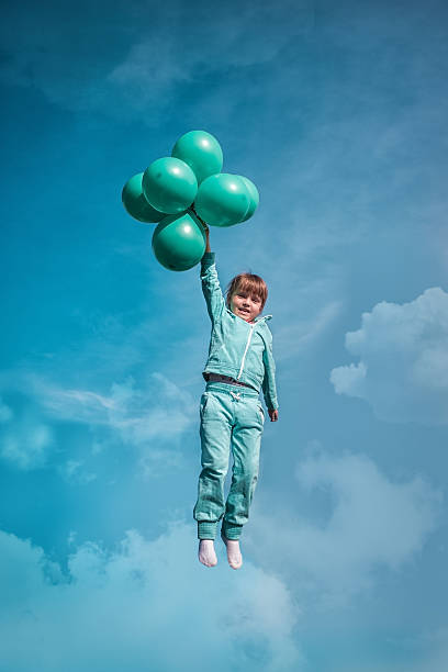istock Little girl with balloons 531478524