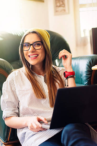 istock Pretty hipster using a laptop and laughing. 531478872