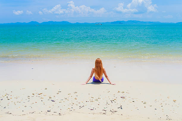 istock woman swimsuit at sandy beach on a sunny day 531479056