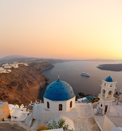 Santorini bell tower and blue domes in Oia on Greece