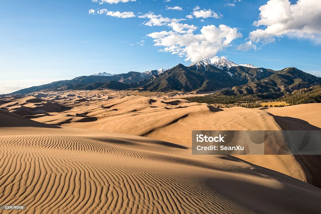 Sunset at Great Sand Dunes Sunset view of sand waves at the top of Great Sand Dunes, Great Sand Dunes National Park & Preserve, Colorado, USA. Great Sand Dunes National Park Stock Photo