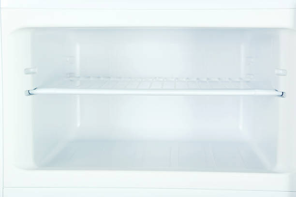 istock The open fridge with the shelves, close up 531480330