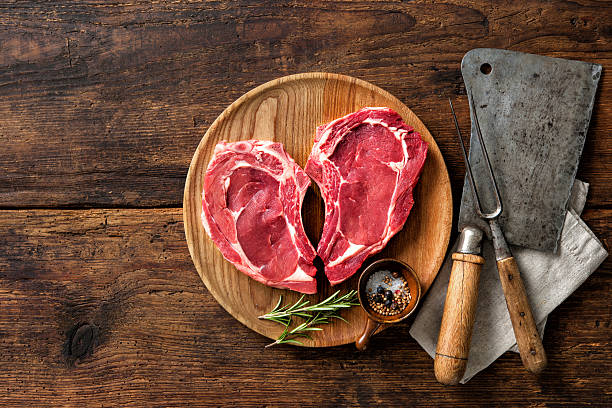 istock Heart shape raw fresh veal meat steaks 531480384