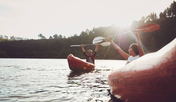istock Happy young couple enjoying canoeing on summer day 531480502