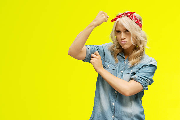 istock Woman flexing muscle 531480984