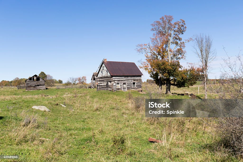 log cabin A log cabin on an old homestead. 2015 Stock Photo