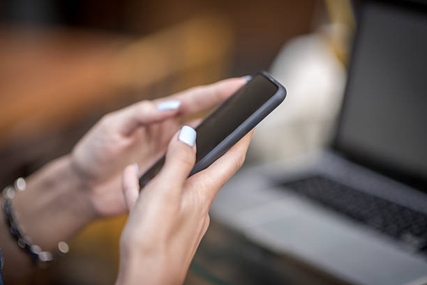 istock Female hands holding mobile phone 531483484