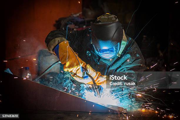 Worker Welding Metal Stock Photo - Download Image Now - Welder, Welding, Construction Industry