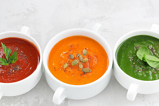 istock assortment of colorful vegetable cream soup on white background 531484276