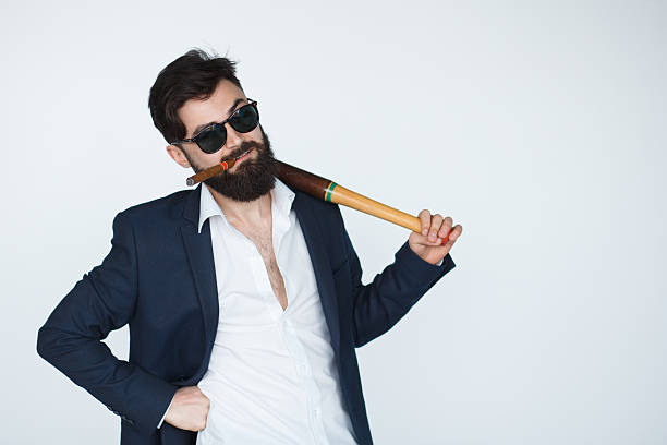 istock Frontview of businessman with baseball bat on shoulder 531484820