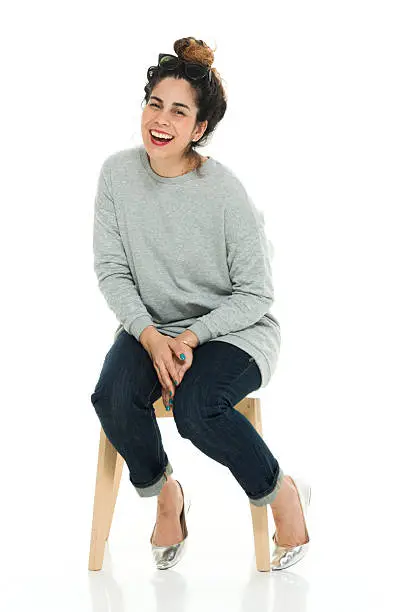 Cheerful woman sitting on chairhttp://www.twodozendesign.info/i/1.png