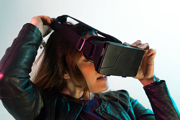 istock Young girl wears a virtual reality headset 531485366