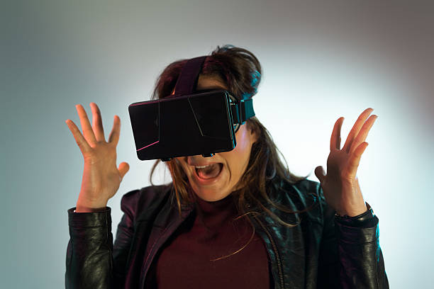 istock Young girl gets scared watching in VR 531485616