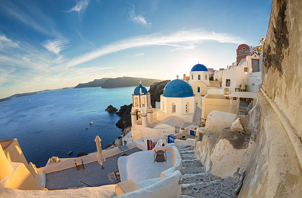 istock Santorini sunset bell tower and domes in Oia on Greece 531485732