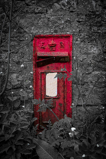 Old letterbox in the stone wall