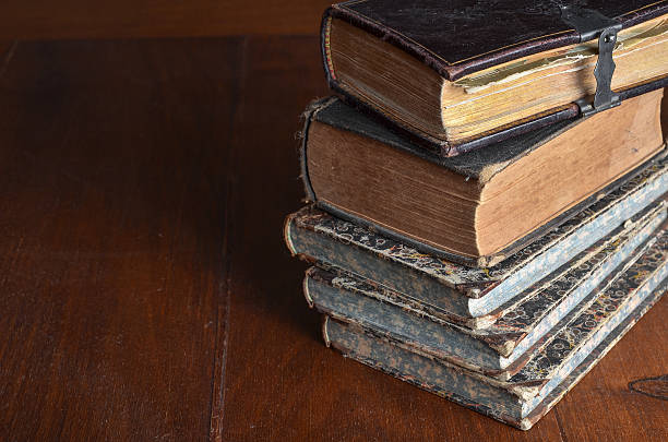 istock pile of old books stacked on a wood table 531487739