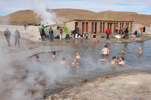 Circa San Pedro De Atacama, Chile - October 25, 2013: Unidentified people bathe in thermal water of the El Tatio geysers on October 25, 2013 circa San Pedro de Atacama, Chile.