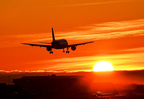 istock Sunset landing to runway 531489581