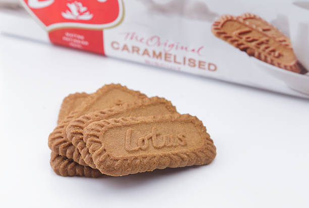 Lotus Biscoff Biscuits Istanbul, Turkey - October 31, 2014: Package and pieces of Lotus Biscoff Original Caramelised Biscuit. Lotus Bakeries is a Belgian company initially specialized the biscuits Lotus Biscuit stock pictures, royalty-free photos & images